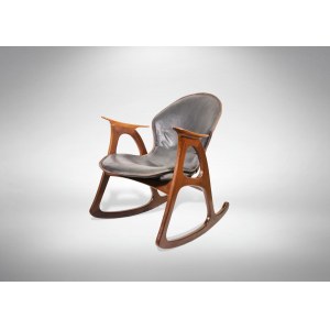 Danish Rocking chair, Very decorative vintage rocking chair made of teak wood wich contrasts with the leather of the seat. it has the tipical carateristics of scandinavian desing from the 1950s and 1960s.