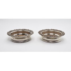 A pair of bottle coasters