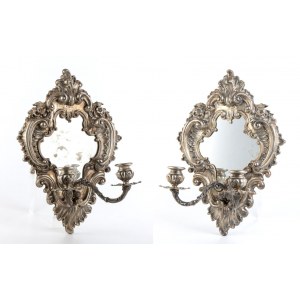 A pair of silver wall sconces