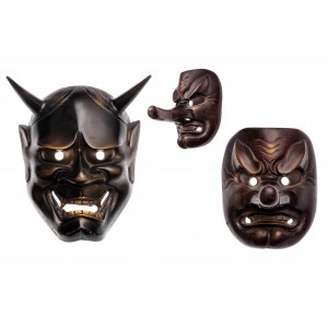 Two cast-iron nō theater masks - hannya and Tengu