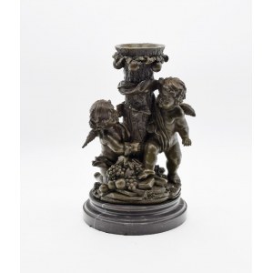 Candle holder with a pair of playing putti