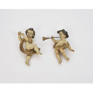 A pair of putti blowing trumpets