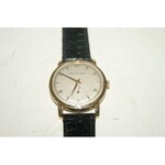 GIRARD PEREGEAUX Montre d'homme en or 18K. Vers 1960. Bracelet en cuir noir. Poids brut : 30 g