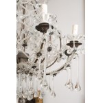 Antique crystal and tin chandelier dating back to the first half of the 20th century.
