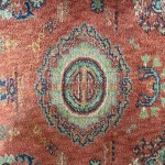 Red embroidered silk carpet