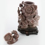 Potiches in stone material with floral and animal decoration