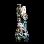 A POLYCHROME ENAMELLED 'KUTANI' PORCELAIN GROUP WITH FIGURES
