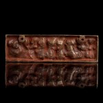A LACQUERED METAL PLAQUE WITH EROTIC SCENES