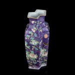 A POLYCHROME ENAMELLED PORCELAIN VASE
