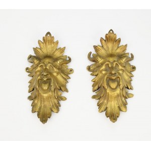 A pair of fittings - mascarons with satyr features