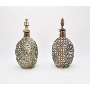 A pair of decanters in an openwork ferrule