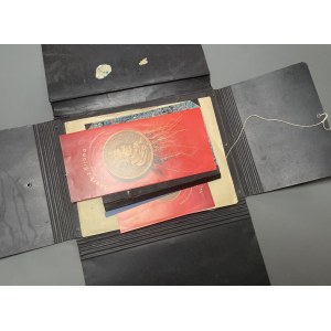 Rubbed folder with small archives