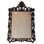 Carved and gilded wooden mirror with floral motif