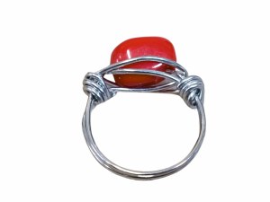Ring with red eyelet