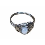 Ring with iridescent faceted eyelet