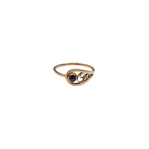 Gold ring with dark maroon eyelet