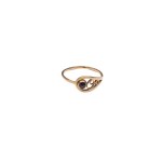 Gold ring with dark maroon eyelet