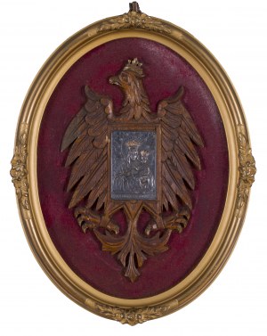 Vlastenecký odznak v podobě orla s Pannou Marií Čenstochovskou na prsou.