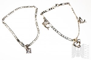 Ensemble de deux bracelets, l'un avec trois breloques en forme de dauphins, l'autre avec des breloques en zircone blanche, argent 925