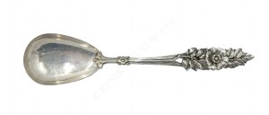 A salad spoon with a floral motif,