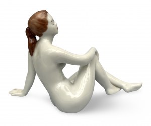 Porcelain figurine of a reclining woman. Hollohaza factory, 1970s, Hungary.