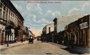 Ramnicu Sarat (Buzau), Strada Victoriei / street view, shops (cut)