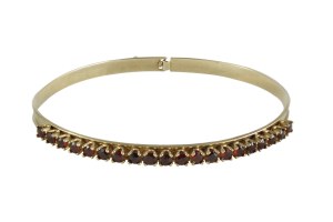 Ellipse bracelet with garnets, 333 gold