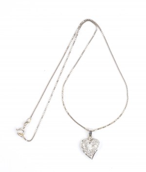 Gold necklace with a heart shaped gold diamond pendant