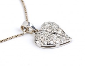 Gold necklace with a heart shaped gold diamond pendant