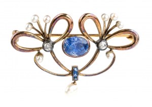 Srebrna broszka z niebieskim szafirem i diamentową perłą