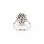 Entourage ring with emerald diamond setting