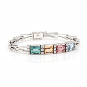 Bracciale con pietre preziose incastonate in diamanti