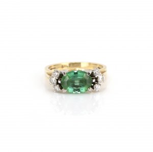 Ring with tourmaline diamond setting