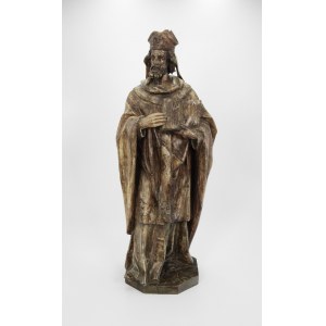 A statue of a bishop with a book