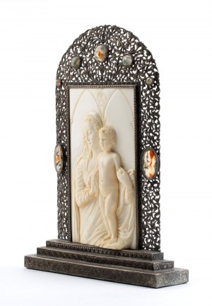 Italian ivory carving depicting the Madonna and Child with silver fame