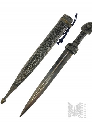 Starý ozdobný kovový nôž s bohato reliéfnou rukoväťou a pošvou