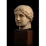 Stone head in Roman style