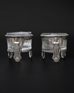 A pair of silver salt shakers