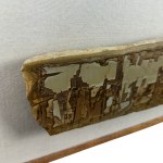 Stone resting on a wooden base