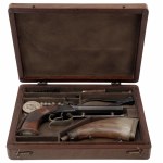 Double barrel percussion pocket pistol in cartridge