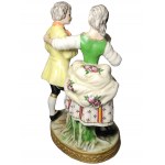 MEISSEN, Man and woman on oval base on grass
