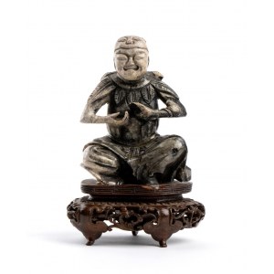 A SOAPSTONE FIGURE OF AN IMMORTAL