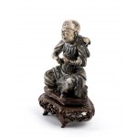 A SOAPSTONE FIGURE OF AN IMMORTAL