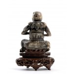 A SOAPSTONE FIGURE OF AN IMMORTAL