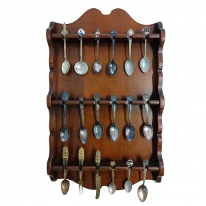 Set of collectible spoons in a wooden display case