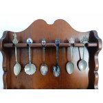 Set of collectible spoons in a wooden display case