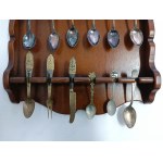 Set of collectible spoons in a wooden display case