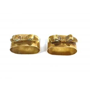 A pair of decorative napkin rings