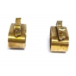 A pair of decorative napkin rings