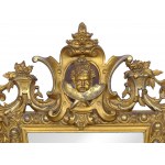 Mirror with finely carved frame and winged angel's head